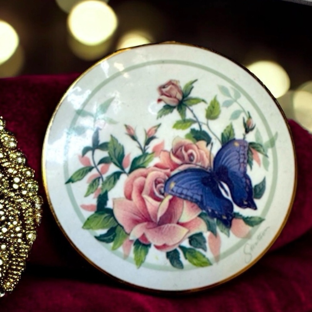 Mid century Stratton powder compact with enamelled floral and butterfly design